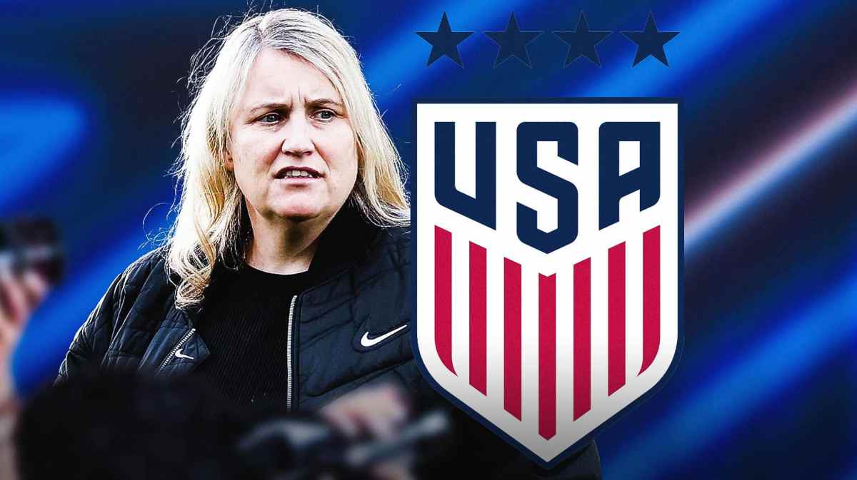 Emma Hayes in front of the USWNT logo