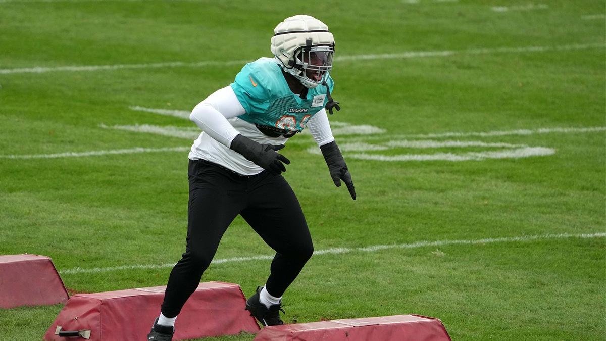 Miami Dolphins defensive end Emmanuel Ogbah (91) participates in drills wearing a Guardian helmet cap during practice at the PSD Bank Arena