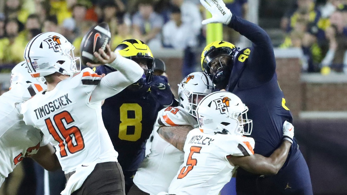 Michigan defensive end Enow Etta rushes against Bowling Green quarterback Hayden Timosciek during the second half of Michigan's 31-6 win