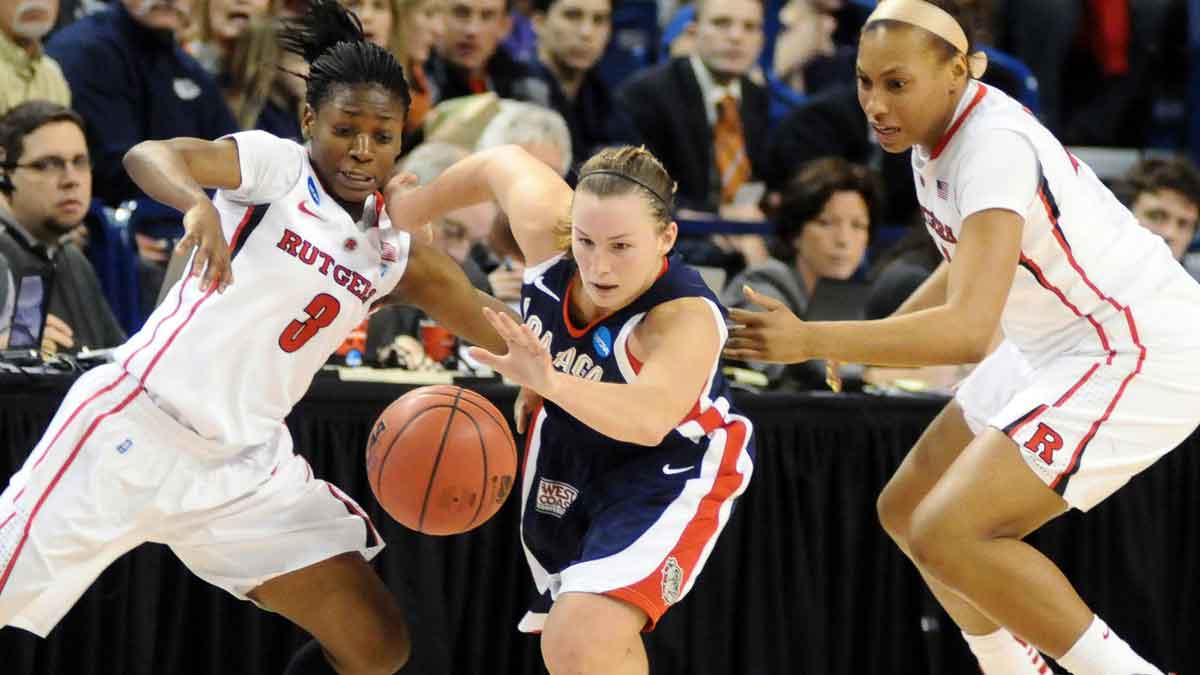 Gonzaga Bulldogs guard Taelor Karr (12) fights for the loose ball with Rutgers Scarlet Knights guard Erica Wheeler (3) and guard Betnijah Laney (44) during the second half in the first round of the 2012 NCAA women's basketball tournament at McCarthey Athletic Center. The Bulldogs defeated the Scarlet Knights 86-73.