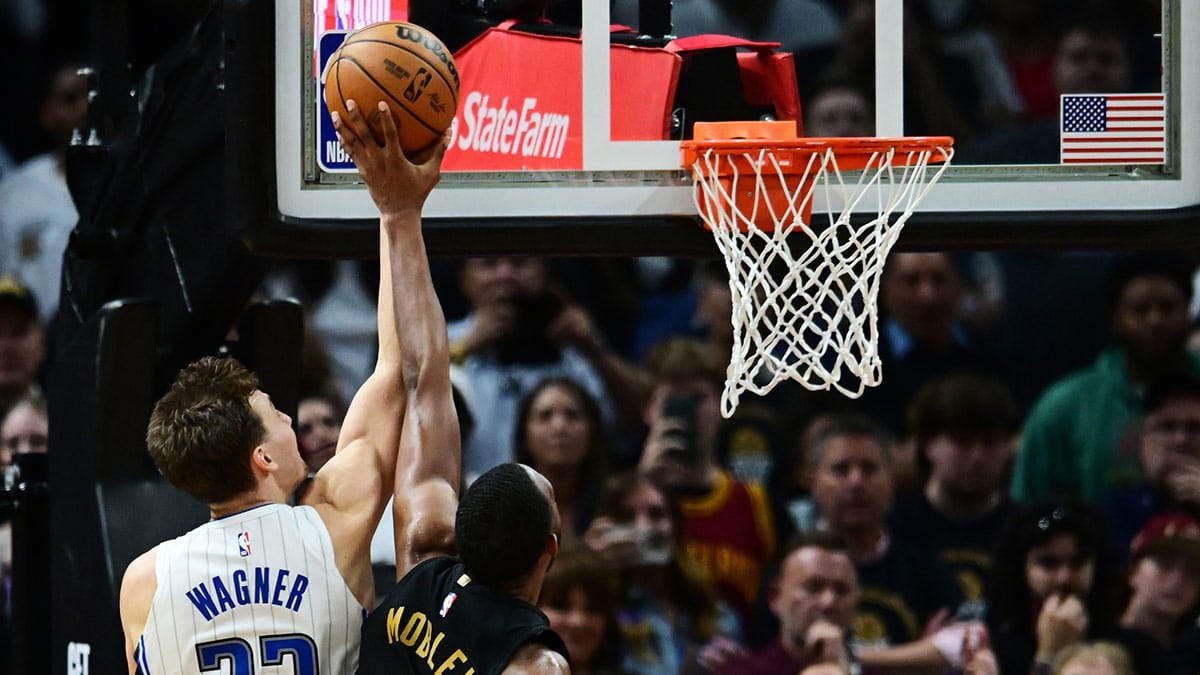 Cleveland Cavaliers forward Evan Mobley (4) blocks the shot of Orlando Magic forward Franz Wagner (22) during the fourth quarter in game five of the first round for the 2024 NBA playoffs at Rocket Mortgage FieldHouse