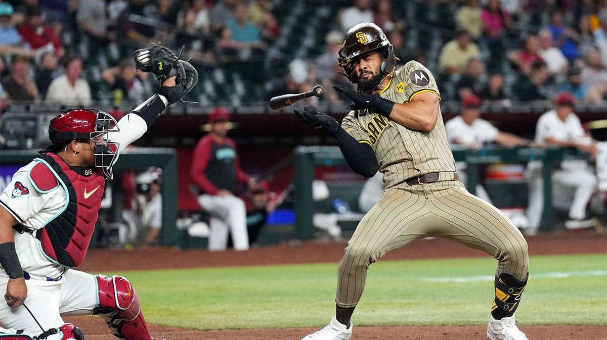 San Diego Padres outfielder Fernando Tatis Jr. (23) dodges a pitch against the Arizona Diamondbacks during the ninth inning at Chase Field. 