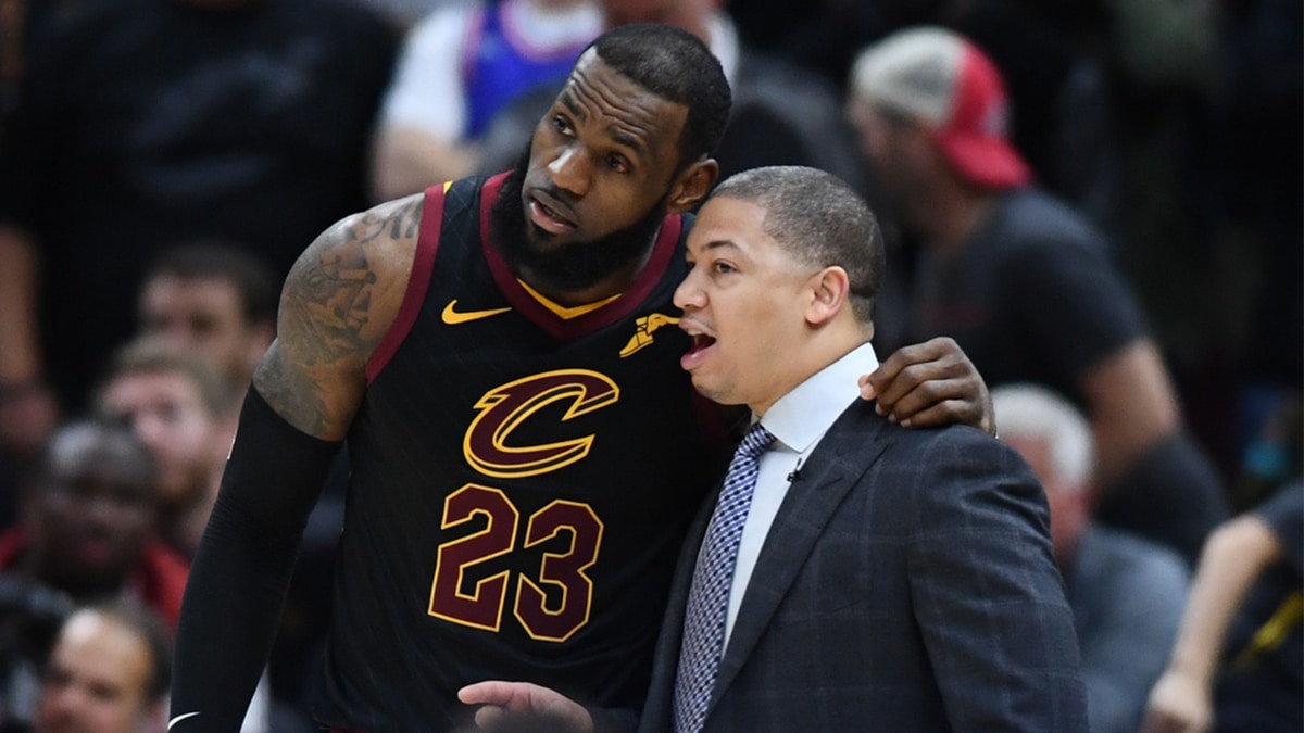 Cleveland Cavaliers forward LeBron James (23) talks with Cavaliers head coach Tyronn Lue