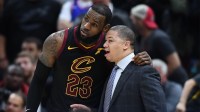 Cleveland Cavaliers forward LeBron James (23) talks with Cavaliers head coach Tyronn Lue