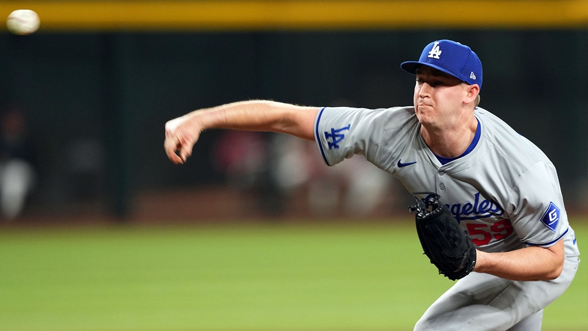  Los Angeles Dodgers pitcher Evan Phillips (59) pitches against the Arizona Diamondbacks during the ninth inning at Chase Field.