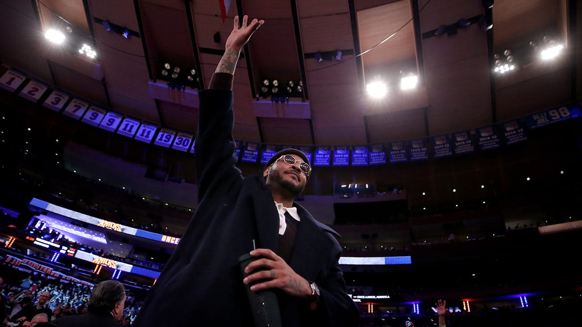 New York Knicks former player Carmelo Anthony acknowledges the crowd after being introduced to the fans during the second quarter against the Houston Rockets at Madison Square Garden.