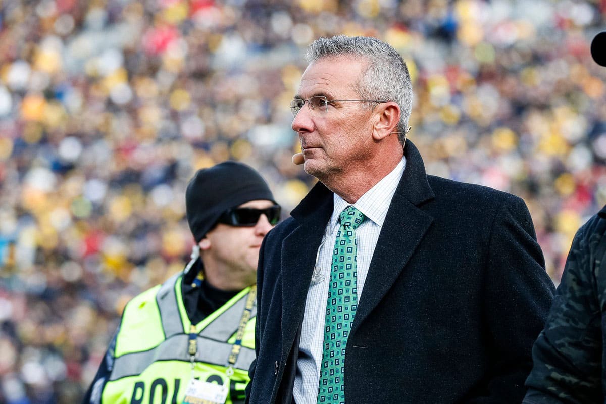 Former Ohio State coach Urban Meyer walks by the end zone during the first half between Michigan and Ohio State at Michigan Stadium in Ann Arbor on Saturday, Nov. 25, 2023.