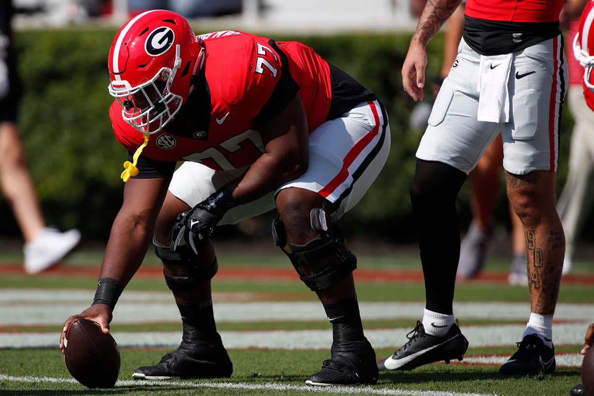 Georgia offensive lineman Sedrick Van Pran (77) warms up wearing number 77 in honer of fallen teammate Devin Willock before the start of a NCAA college football game against Ball State in Athens, Ga., on Saturday, Sept. 9, 2023.