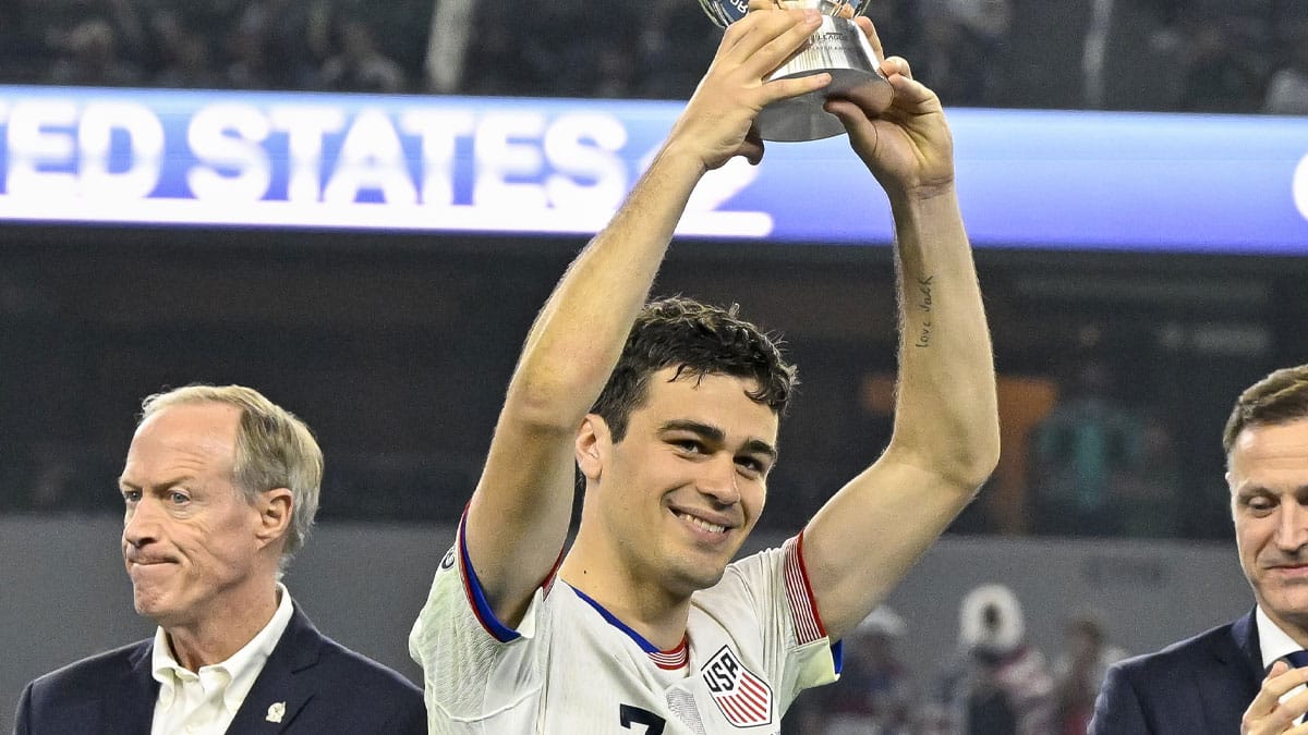 United States forward Gio Reyna (7) receives the best player award after the Concacaf Nations League Final between the United States and Mexico at AT&T Stadium