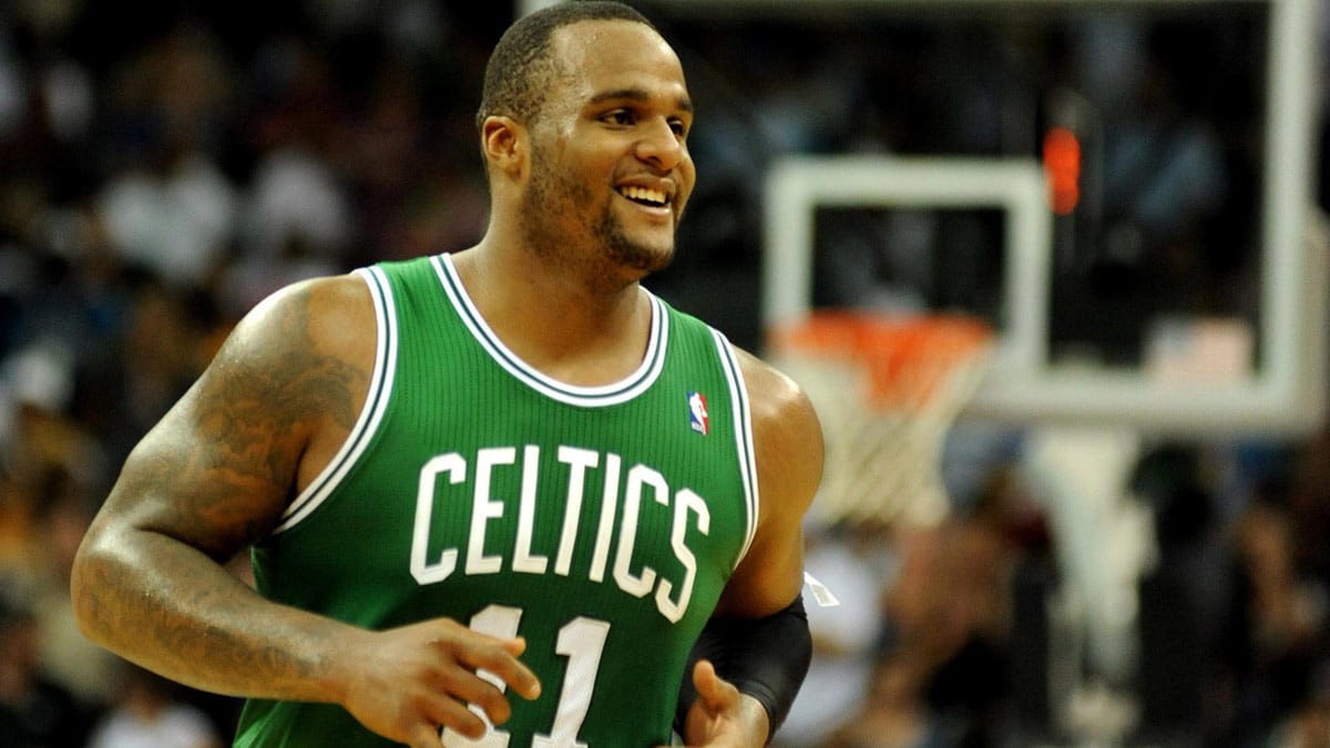 Boston Celtics power forward Glen Davis (11) smiles as he runs off court after the Celtics took a lead over the New Orleans Hornets late in the game at the New Orleans Arena.