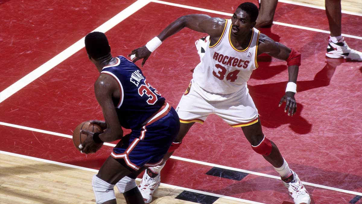 Houston Rockets center Hakeem Olajuwon (34) defends New York Knicks center Patrick Ewing (33) during the 1994 NBA Finals at the Summit.