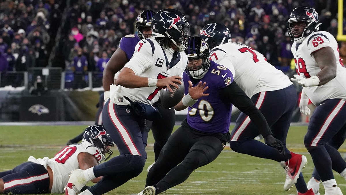 Houston Texans quarterback C.J. Stroud (7) scrambles out of the pocket against Baltimore Ravens linebacker Kyle Van Noy (50) during the fourth quarter of a 2024 AFC divisional round game