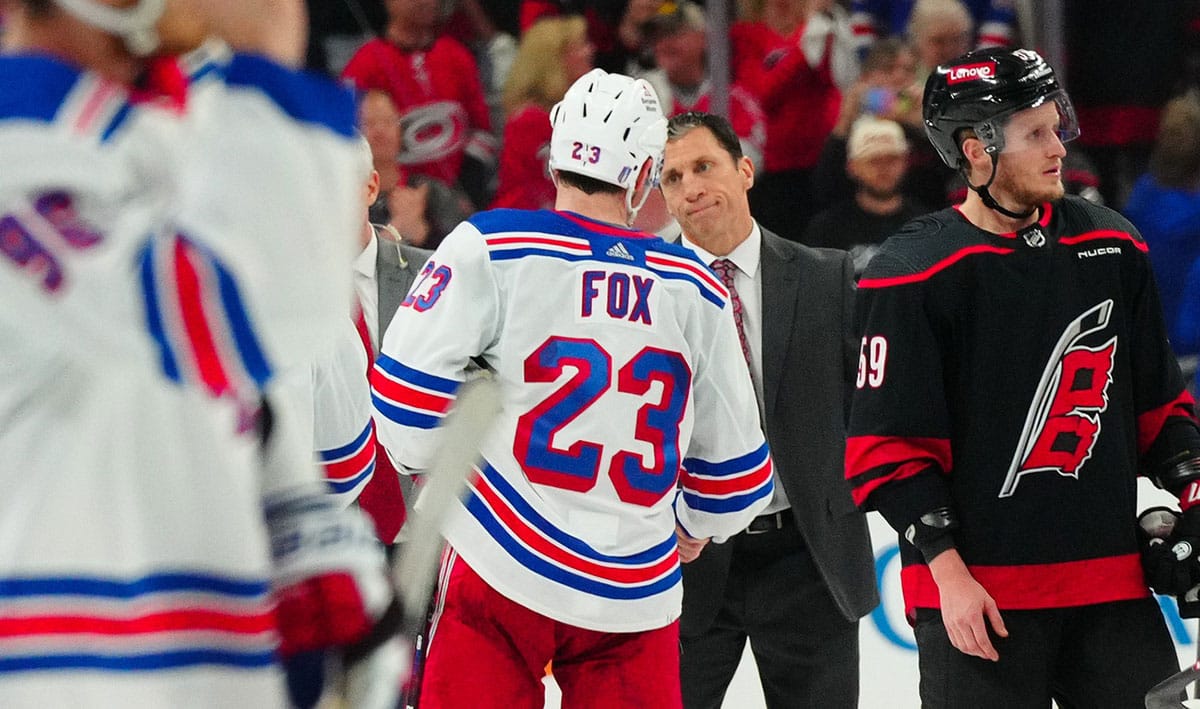 Carolina Hurricanes head coach Rod Brind’Amour shake hands with New York Rangers defenseman Adam Fox (23) after the Rangers win in game six of the second round of the 2024 Stanley Cup Playoffs at PNC Arena.