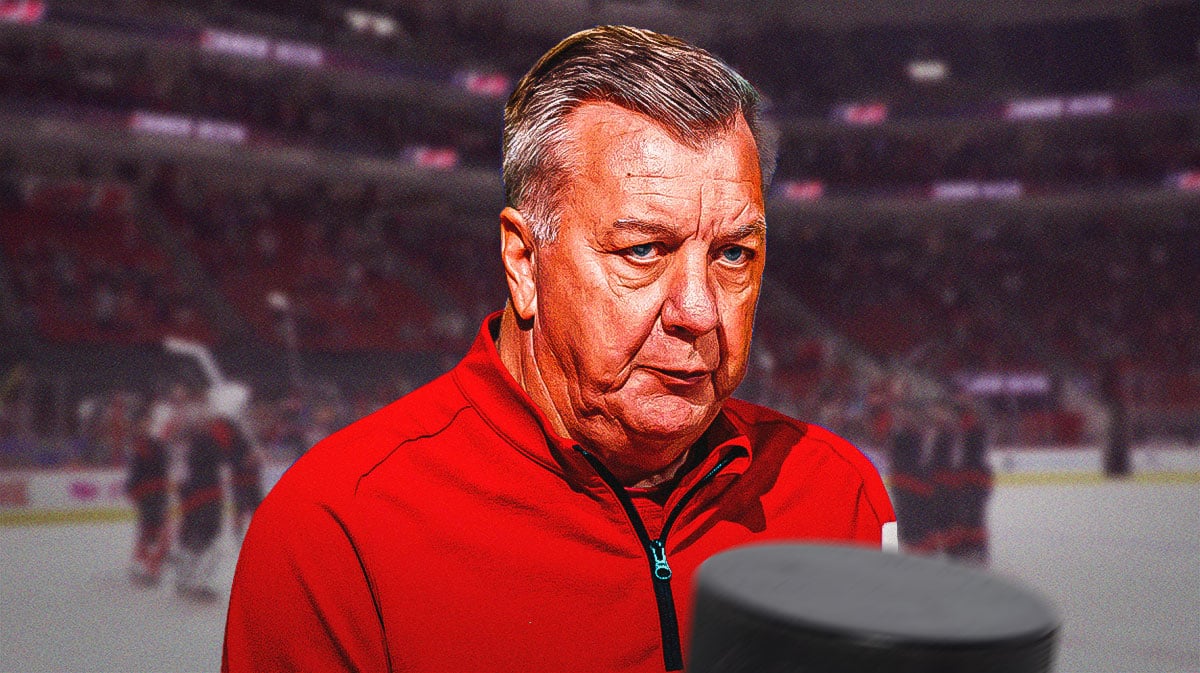 Don Waddell looking with Hurricanes arena in background