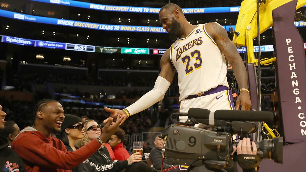 Los Angeles Lakers forward LeBron James (23) shakes hands with his son Bronny James during the second half against the Houston Rockets at Crypto.com Arena.