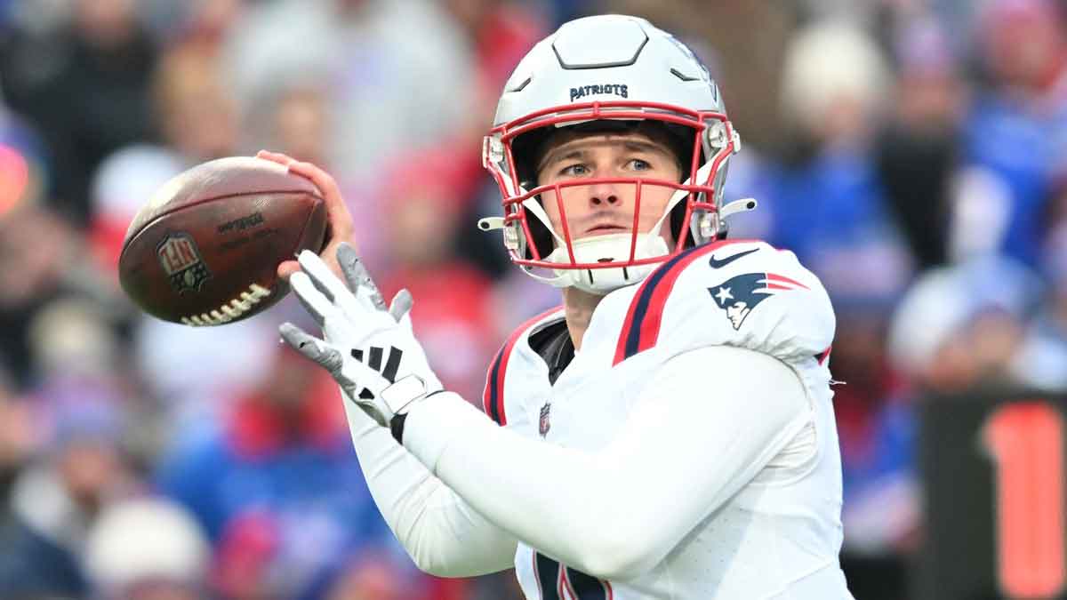 New England Patriots quarterback Bailey Zappe (4) throws a pass in the first quarter against the Buffalo Bills at Highmark Stadium. 