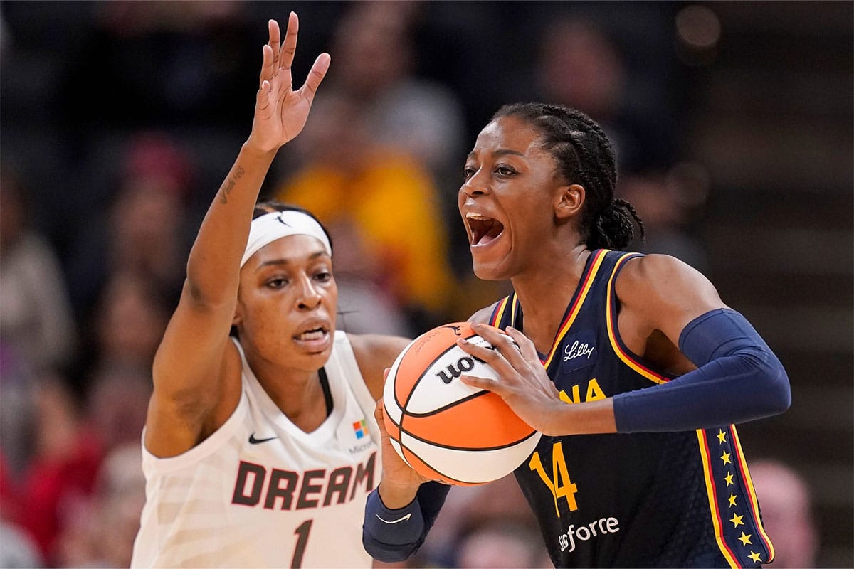 Indiana Fever forward Temi Fagbenle (14) passes the ball Thursday, May 9, 2024, during the preseason game against the Atlanta Dream at Gainbridge Fieldhouse in Indianapolis.