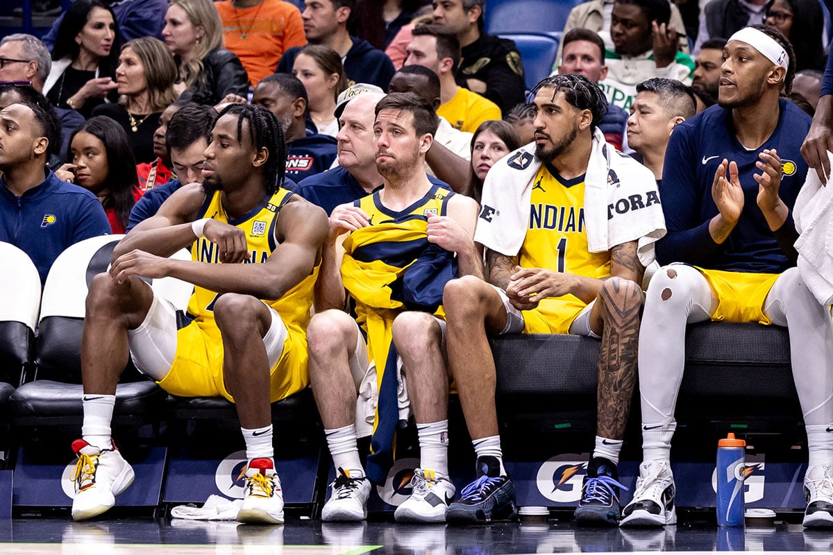 Indiana Pacers guard T.J. McConnell (9) and forward Obi Toppin (1) look on from the bench against the New Orleans Pelicans during the second half at Smoothie King Center. 