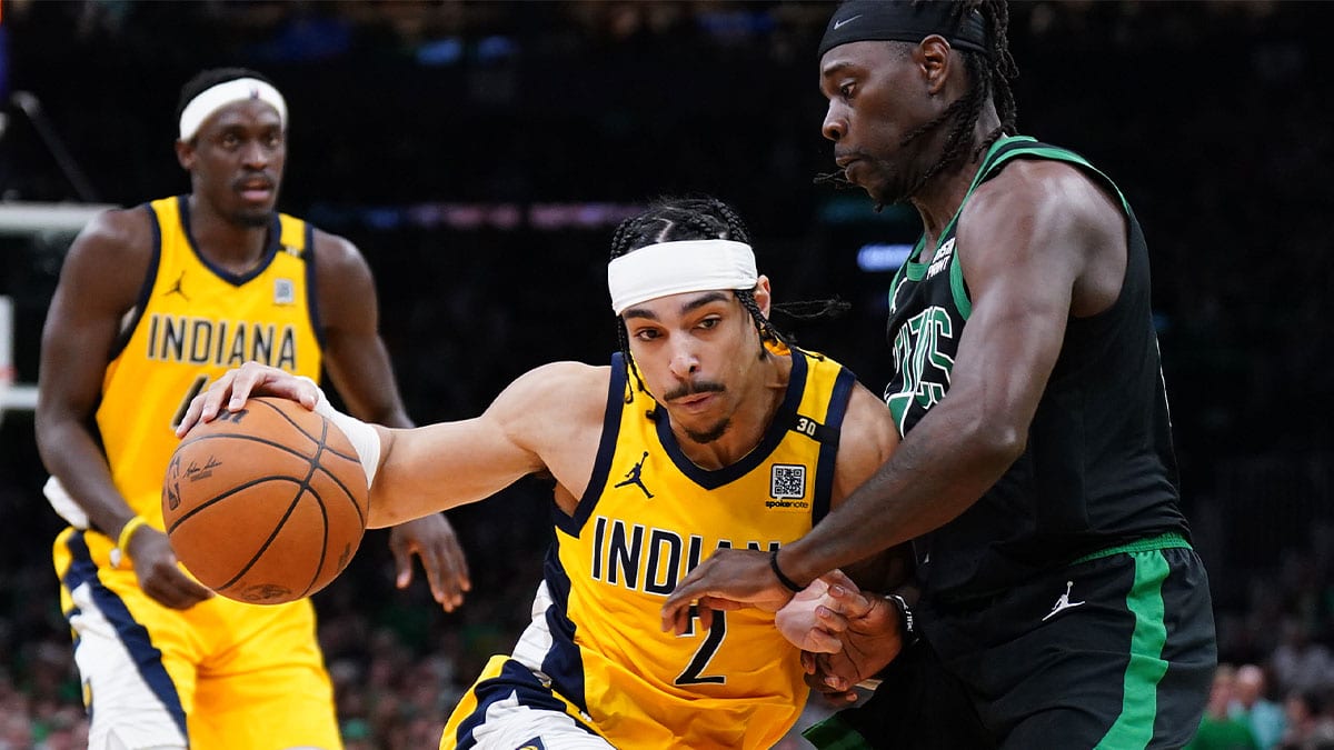 May 23, 2024; Boston, Massachusetts, USA;Indiana Pacers guard Andrew Nembhard (2) dribbles the ball against Boston Celtics guard Jrue Holiday (4) in the first half during game two of the eastern conference finals for the 2024 NBA playoffs at TD Garden. Mandatory Credit: David Butler II-USA TODAY Sports