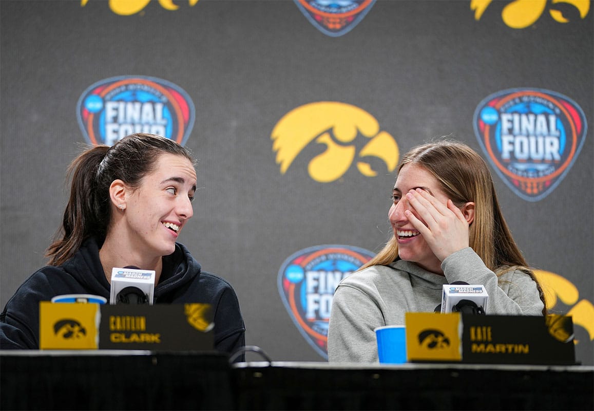 Iowa Hawkeyes guard Caitlin Clark (22) and Iowa Hawkeyes guard Kate Martin (20) take questions at Rocket Mortgage Arena, Thursday, April 4, 2024 in Cleveland.