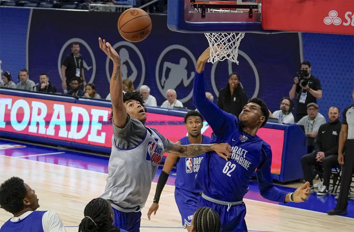 Ulrich Chomche (62) and Izane Almansa (60) participate during the 2024 NBA Draft Combine at Wintrust Arena.