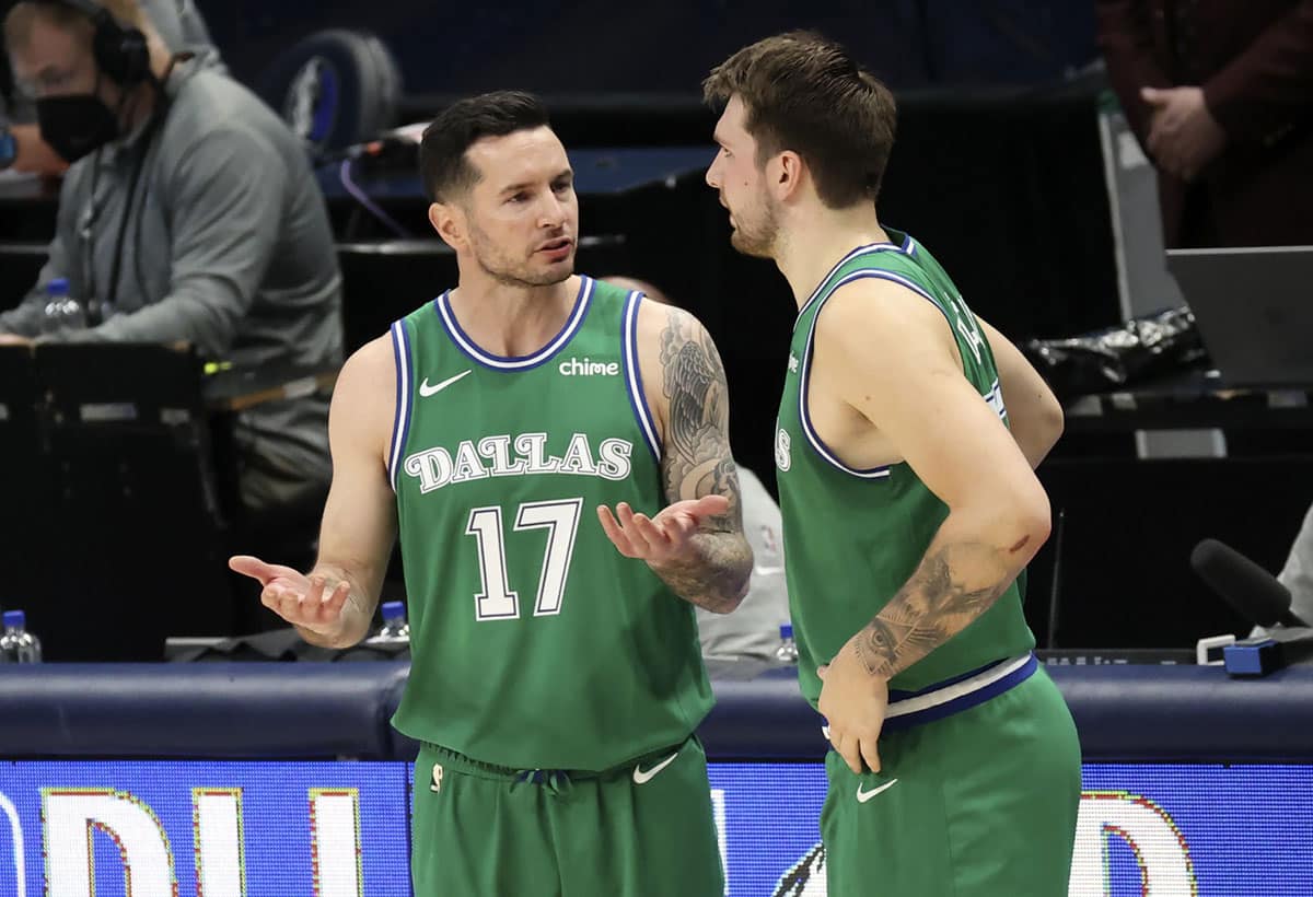 Dallas Mavericks guard JJ Redick (17) speaks with guard Luka Doncic (77) during the second quarter against the New York Knicks at American Airlines Center