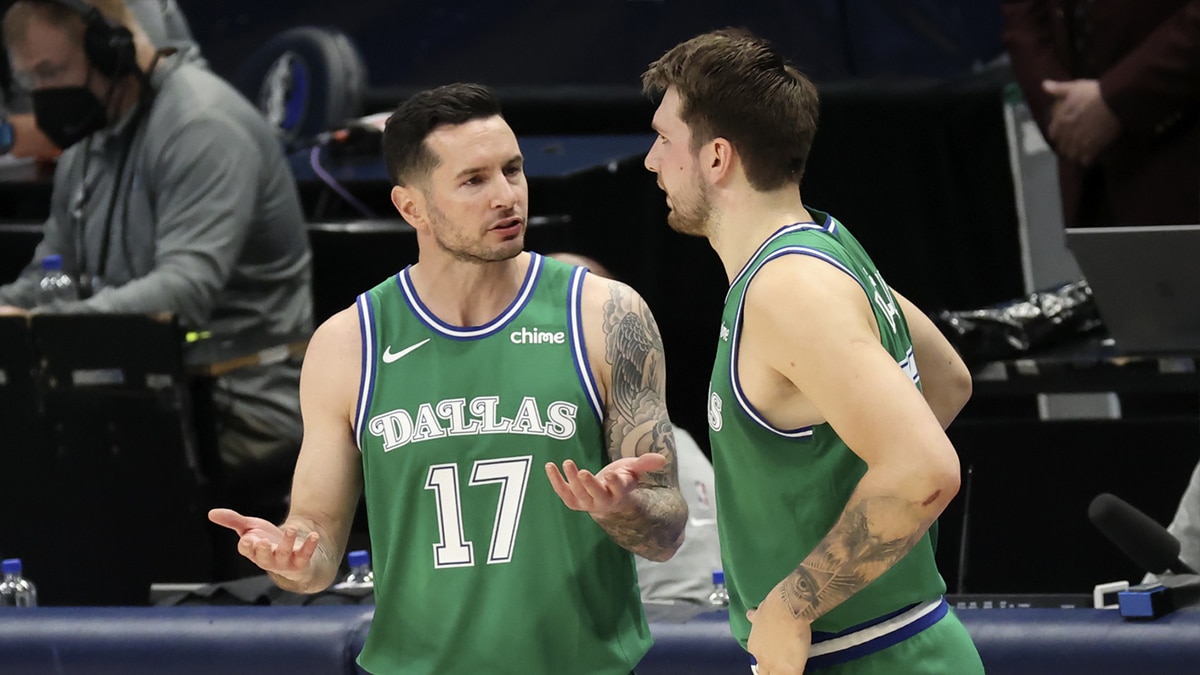 Dallas Mavericks guard JJ Redick (17) speaks with guard Luka Doncic (77) during the second quarter against the New York Knicks at American Airlines Center.