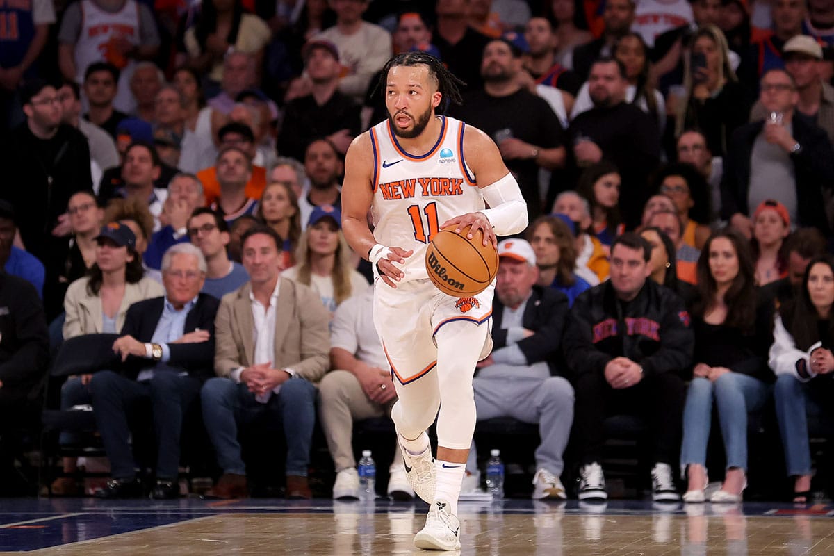 New York Knicks guard Jalen Brunson (11) brings the ball up court against the Indiana Pacers during the third quarter of game seven of the second round of the 2024 NBA playoffs at Madison Square Garden.