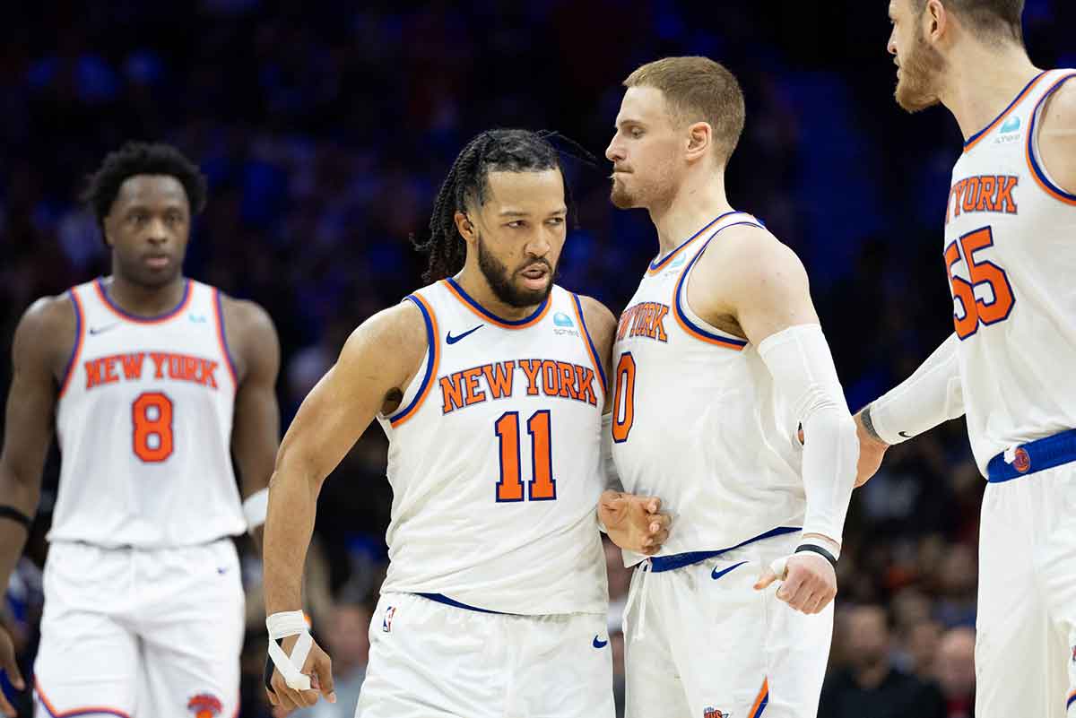 New York Knicks guard Jalen Brunson (11) reacts with guard Donte DiVincenzo (0) after scoring against the Philadelphia 76ers during the second half of game six of the first round for the 2024 NBA playoffs at Wells Fargo Center