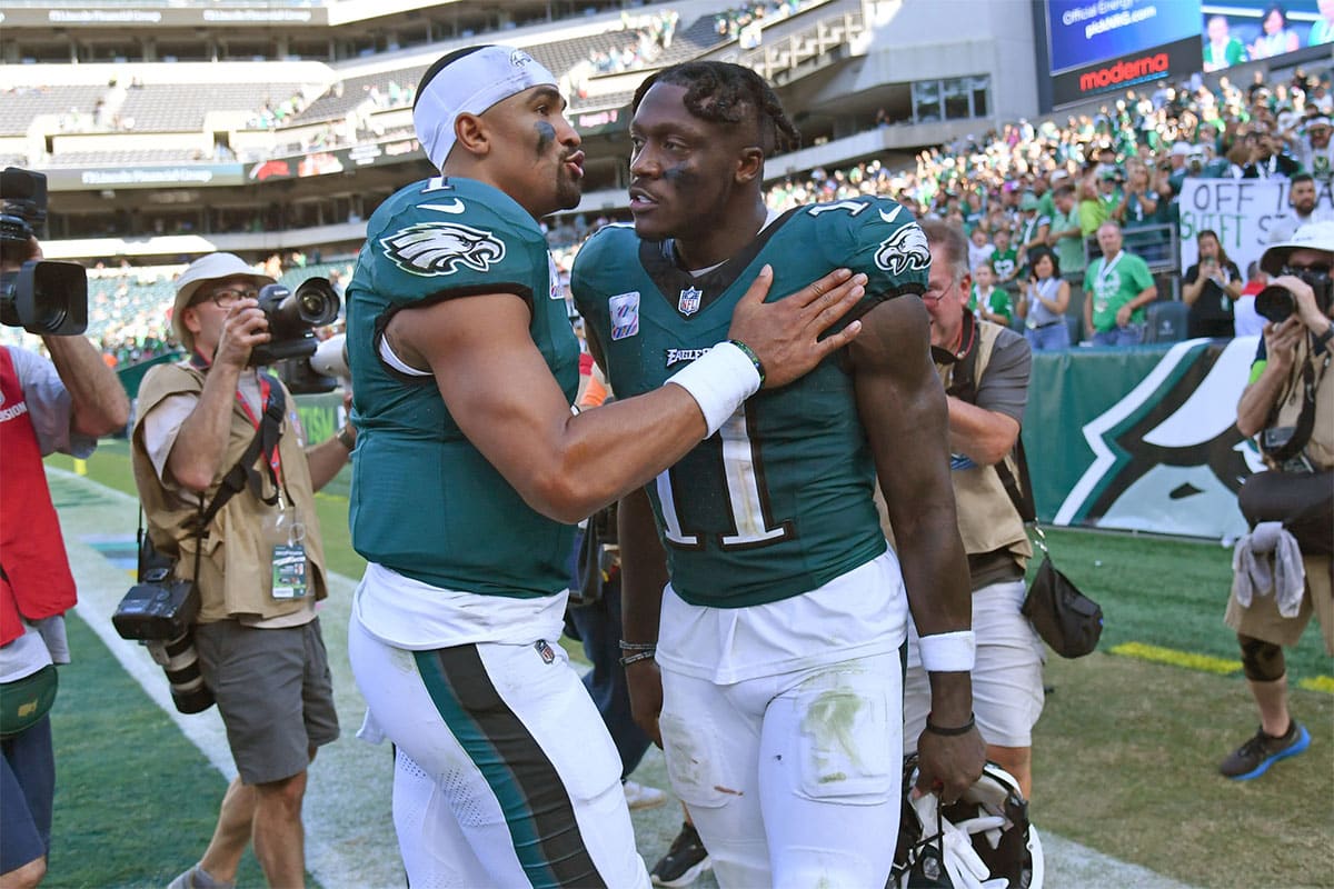 Philadelphia Eagles quarterback Jalen Hurts (1) and wide receiver A.J. Brown (11) walk off the field against the Washington Commanders at Lincoln Financial Field.