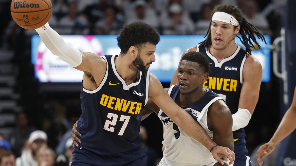 Denver Nuggets guard Jamal Murray (27) works around Minnesota Timberwolves guard Anthony Edwards (5) as forward Aaron Gordon (50) sets a pick in the third quarter of game four of the second round for the 2024 NBA playoffs at Target Center.