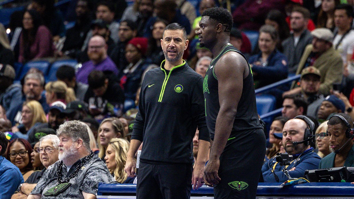New Orleans Pelicans acting head coach James Borrego talks with forward Zion Williamson (1) against the Dallas Mavericks during the second half at the Smoothie King Center. 