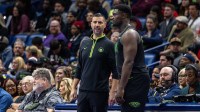 New Orleans Pelicans acting head coach James Borrego talks with forward Zion Williamson (1) against the Dallas Mavericks during the second half at the Smoothie King Center.