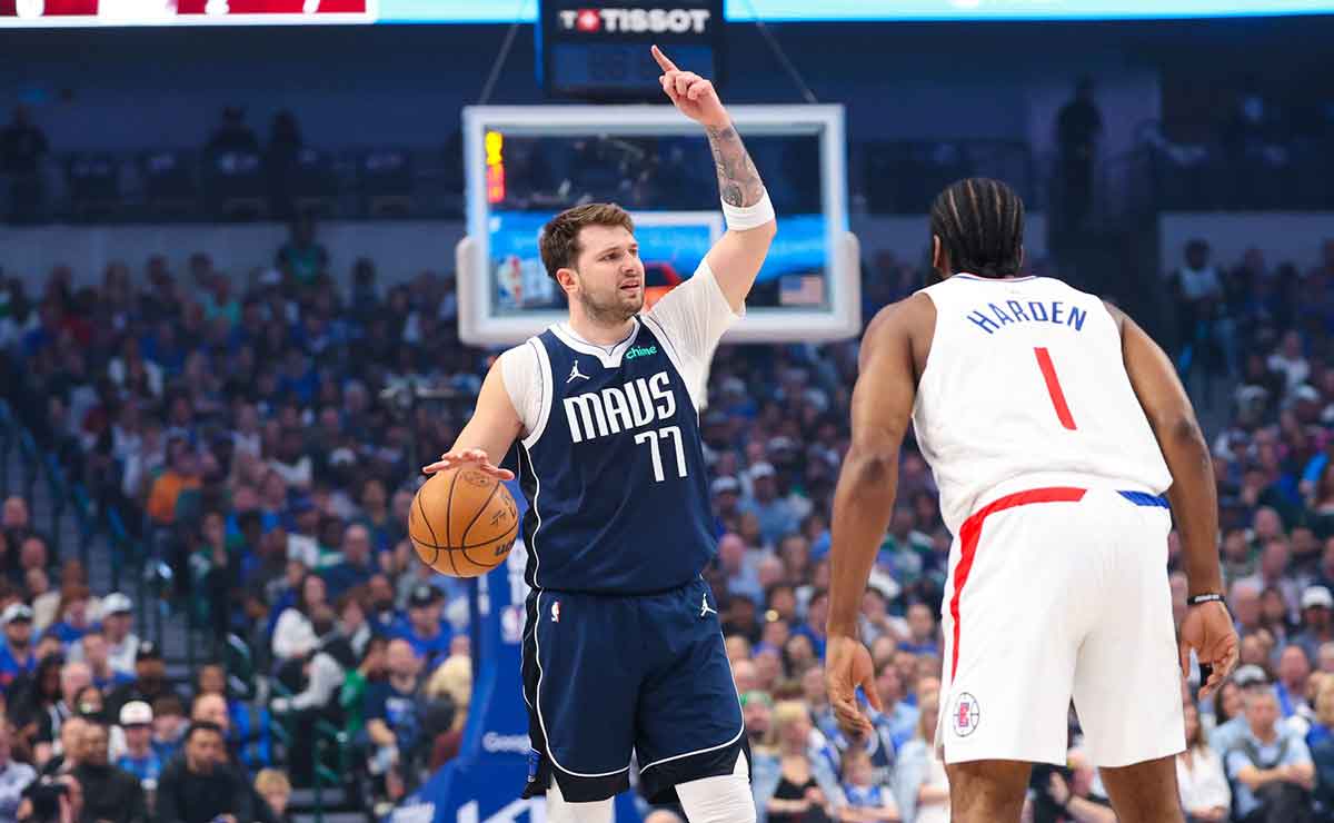Dallas Mavericks guard Luka Doncic (77) controls the ball as LA Clippers guard James Harden (1) defends during the first quarter during game four of the first round for the 2024 NBA playoffs at American Airlines Center.