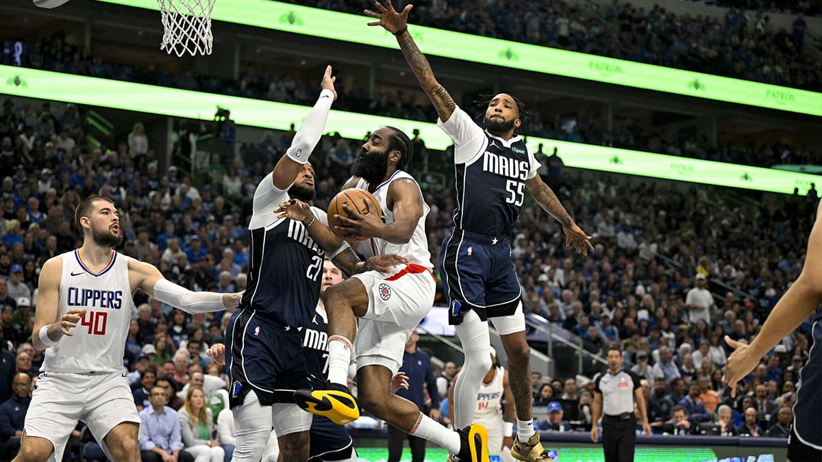 LA Clippers guard James Harden (1) drives to the basket past Dallas Mavericks forward P.J. Washington (25) and forward Derrick Jones Jr. (55) during the second quarter during game three of the first round for the 2024 NBA playoffs at the American Airlines Center.