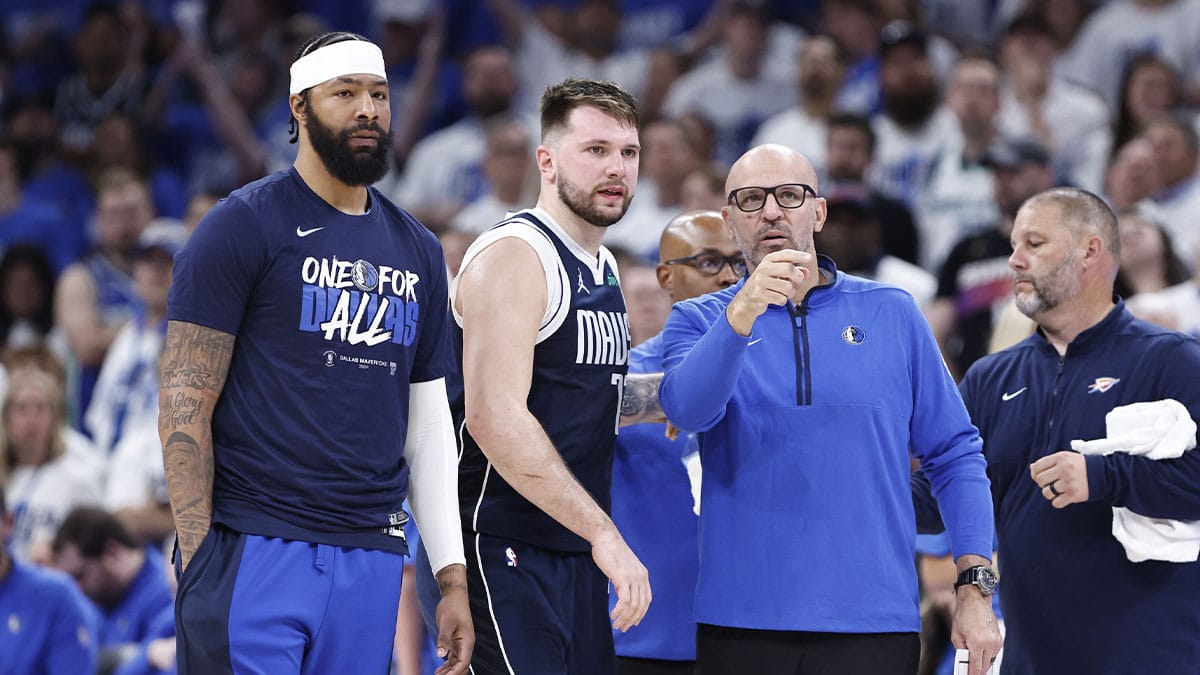 Dallas Mavericks head coach Jason Kidd talks to Dallas Mavericks guard Luka Doncic (77) during a time out against the Oklahoma City Thunder during the second half of game one of the second round for the 2024 NBA playoffs at Paycom Center. 