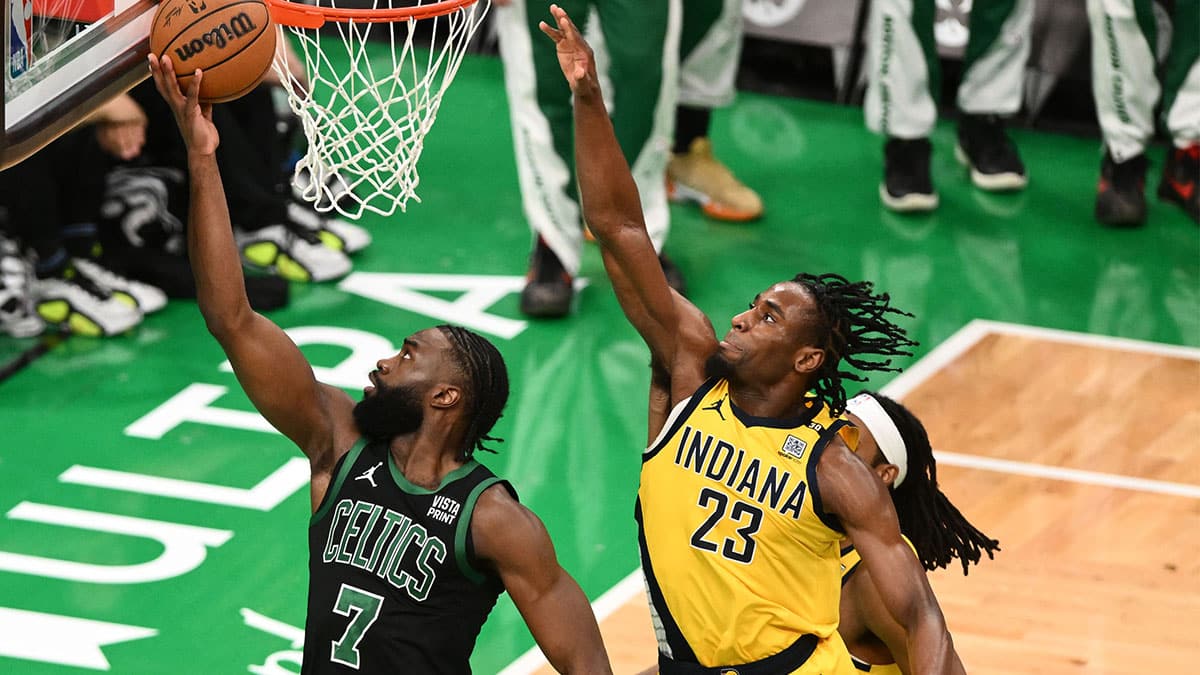 Boston Celtics guard Jaylen Brown (7) shoots the ball past Indiana Pacers forward Aaron Nesmith (23) in the first half during game two of the eastern conference finals for the 2024 NBA playoffs at TD Garden. 