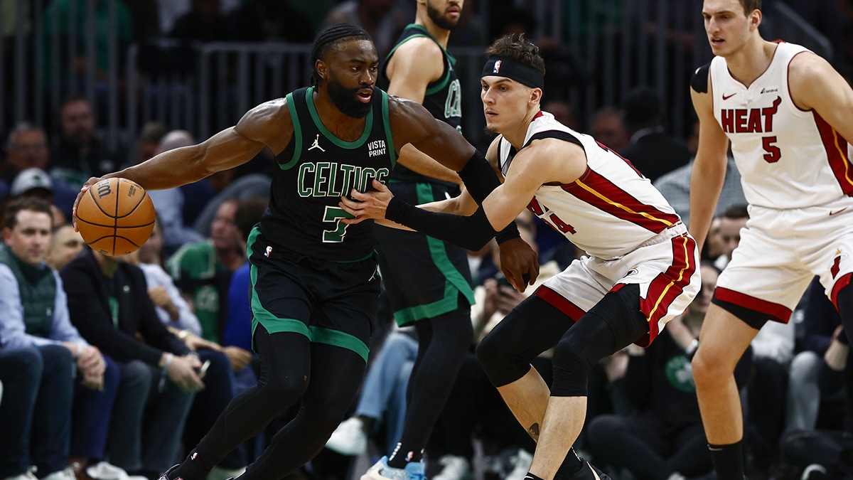 Boston Celtics guard Jaylen Brown (7) looks to get around Miami Heat guard Tyler Herro (14) during the first quarter of game five of the first round of the 2024 NBA playoffs at TD Garden.