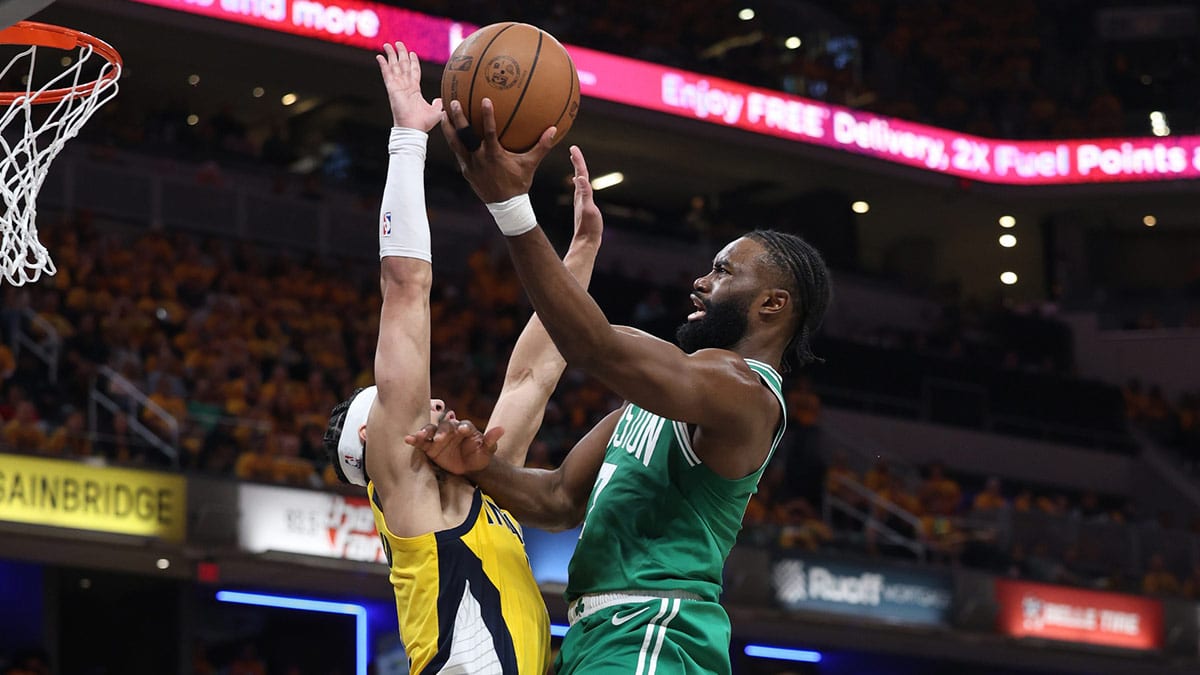 Boston Celtics guard Jaylen Brown (7) shoots the ball against Indiana Pacers guard Andrew Nembhard (2) during the third quarter of game three of the eastern conference finals in the 2024 NBA playoffs at Gainbridge Fieldhouse.