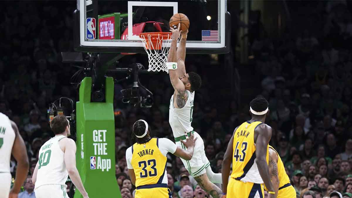 Boston Celtics forward Jayson Tatum (0) drives to the basket against Indiana Pacers center Myles Turner (33) in the second quarter during game one of the eastern conference finals for the 2024 NBA playoffs at TD Garden.