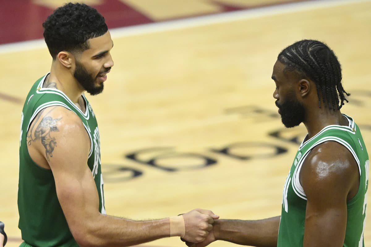  Boston Celtics forward Jayson Tatum (0) and guard Jaylen Brown (7) celebrate after a win over the Cleveland Cavaliers in game four of the second round for the 2024 NBA playoffs at Rocket Mortgage FieldHouse