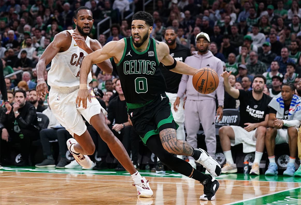 Boston Celtics forward Jayson Tatum (0) drives the ball against Cleveland Cavaliers forward Evan Mobley (4) in the third quarter during game five of the second round for the 2024 NBA playoffs at TD Garden. 