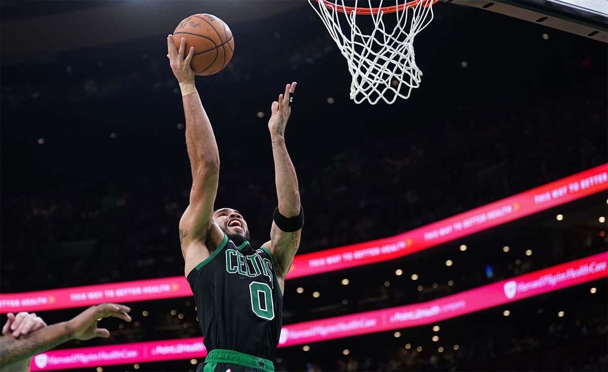 Boston Celtics forward Jayson Tatum (0) drives to the basket against the Cleveland Cavaliers in the third quarter during game five of the second round for the 2024 NBA playoffs at TD Garden.