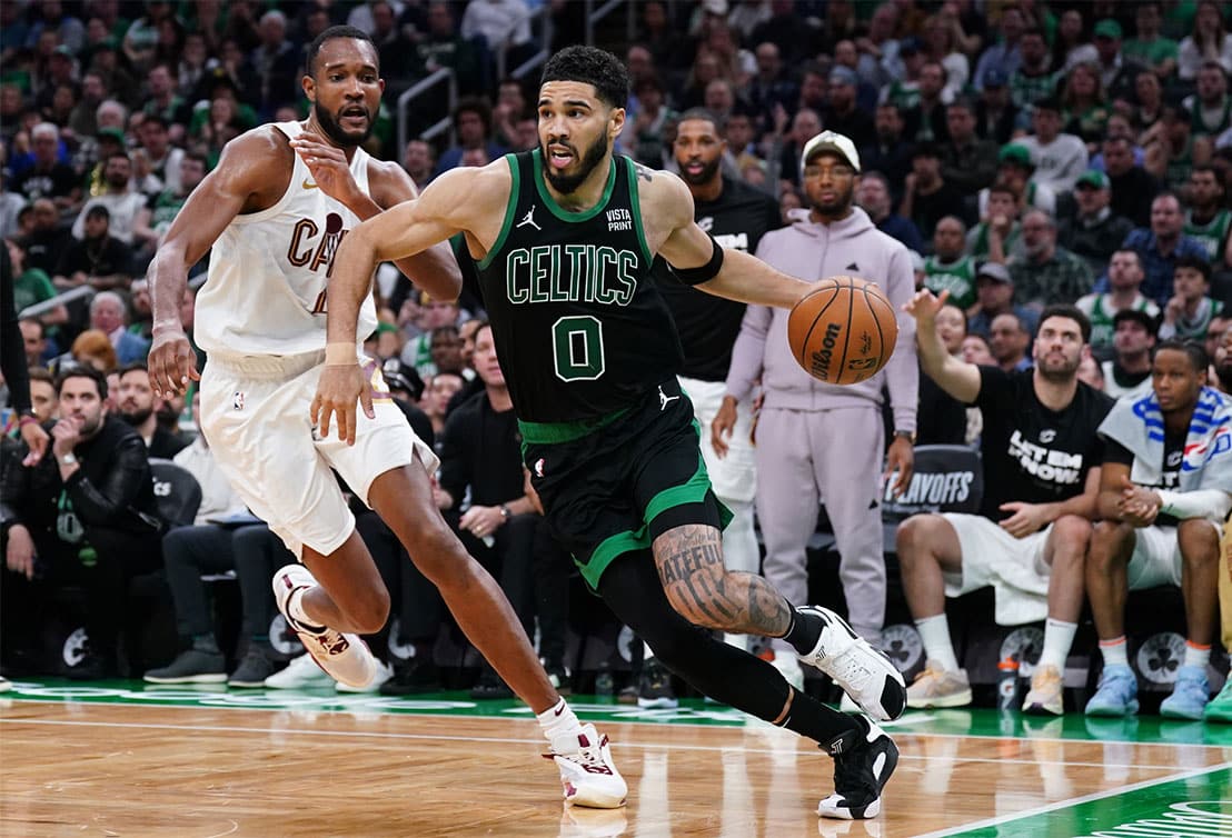 Boston Celtics forward Jayson Tatum (0) drives the ball against Cleveland Cavaliers forward Evan Mobley (4) in the third quarter during game five of the second round for the 2024 NBA playoffs at TD Garden.