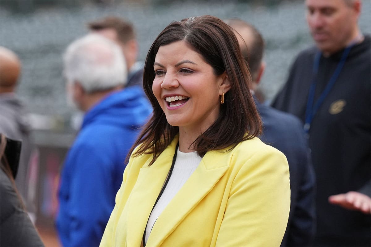 Oakland Athletics play-by-play announcer Jenny Cavnar stands on the field before the game against the Cleveland Guardians at Oakland-Alameda County Coliseum.