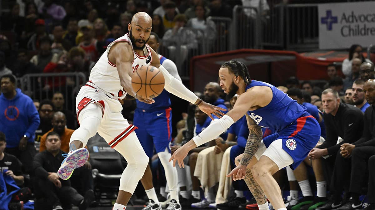 Chicago Bulls guard Jevon Carter (5) chases a pass by LA Clippers guard Amir Coffey (7) during the second half at the United Center