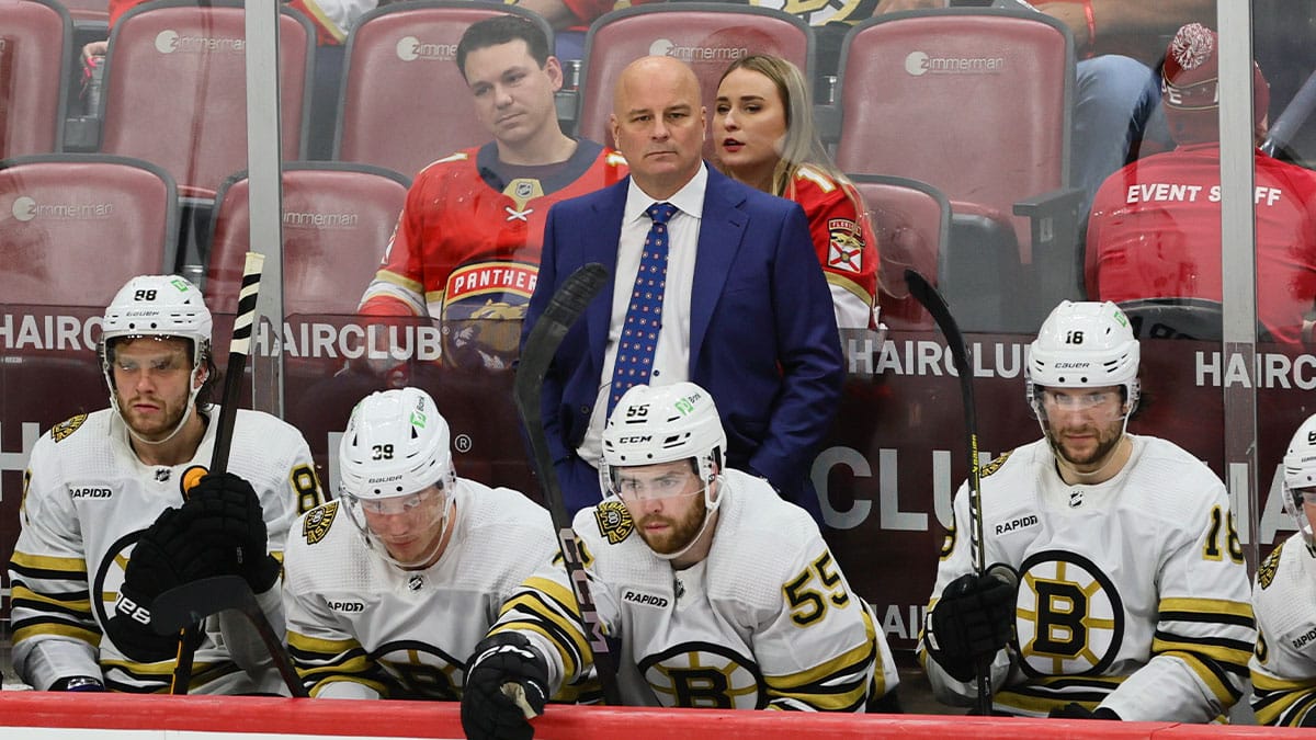 Boston Bruins head coach Jim Montgomery watches from the bench against the Florida Panthers during the third period in game one of the second round of the 2024 Stanley Cup Playoffs at Amerant Bank Arena.