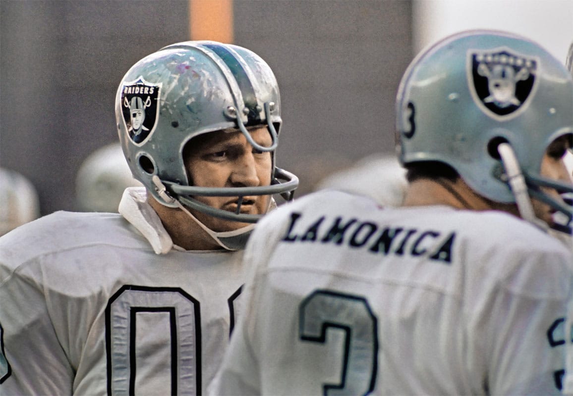 Oakland Raiders center Jim Otto (00) talks to Daryle Lamonica (3) on the sideline against the New York Jets at Shea Stadium.