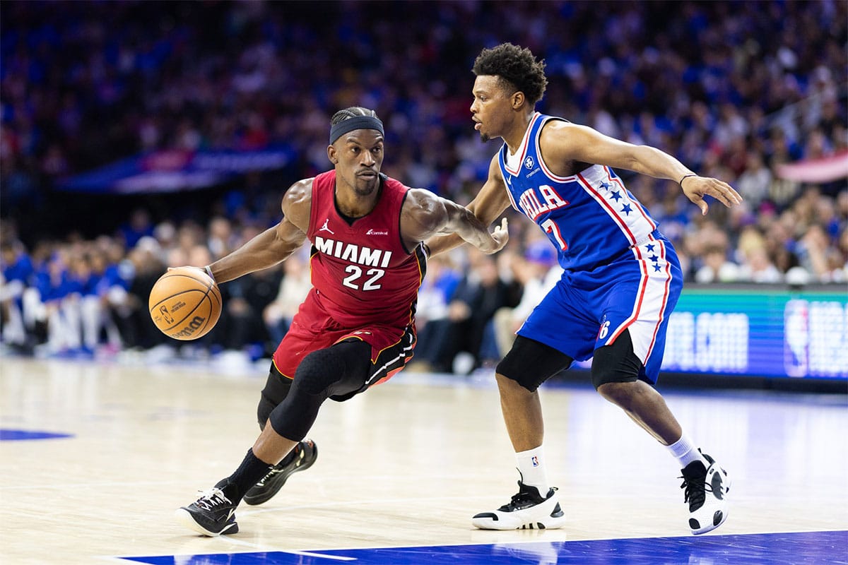 Miami Heat forward Jimmy Butler (22) dribbles the ball past Philadelphia 76ers guard Kyle Lowry (7) during the second quarter of a play-in game of the 2024 NBA playoffs at Wells Fargo Center.