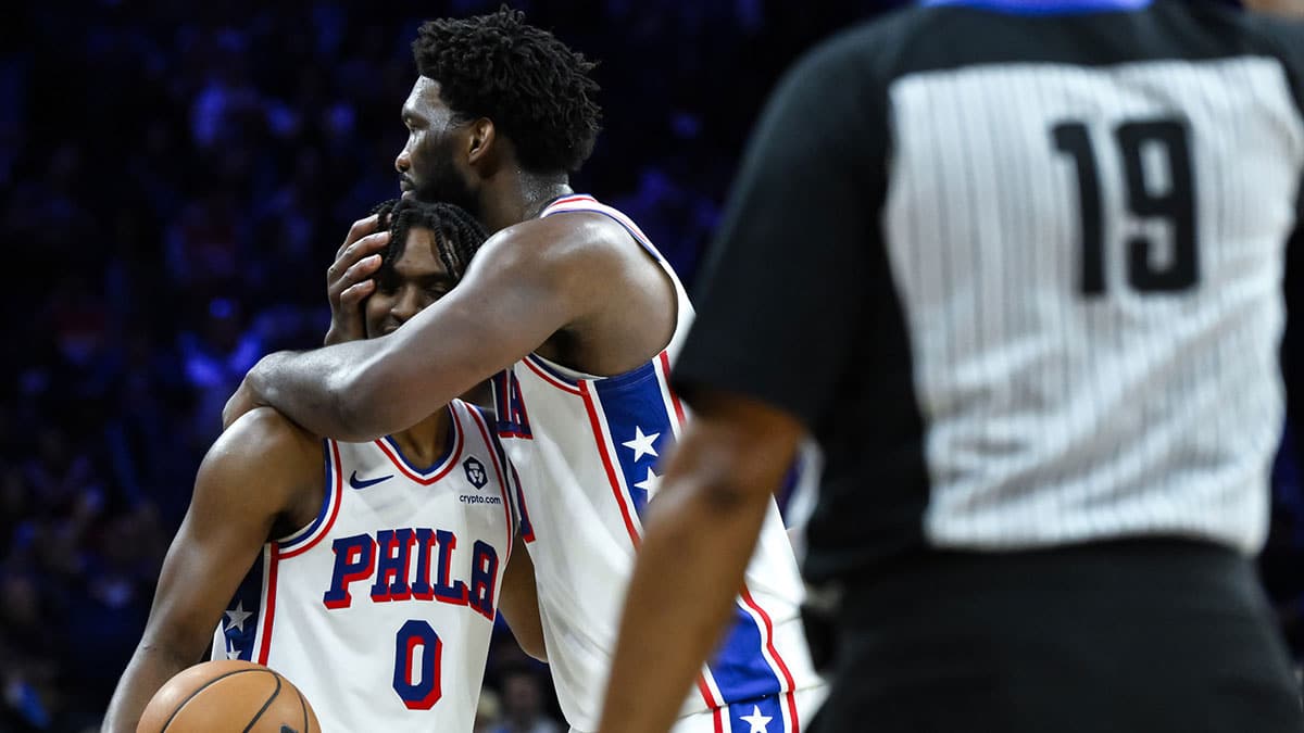Philadelphia 76ers guard Tyrese Maxey (0) is embraced by Philadelphia 76ers center Joel Embiid (21) after a 50 point scoring night against the Indiana Pacers at Wells Fargo Center.